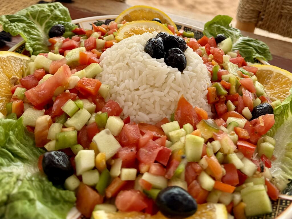 Colorful Moroccan salad with local ingredients – traditional Moroccan food presentation.