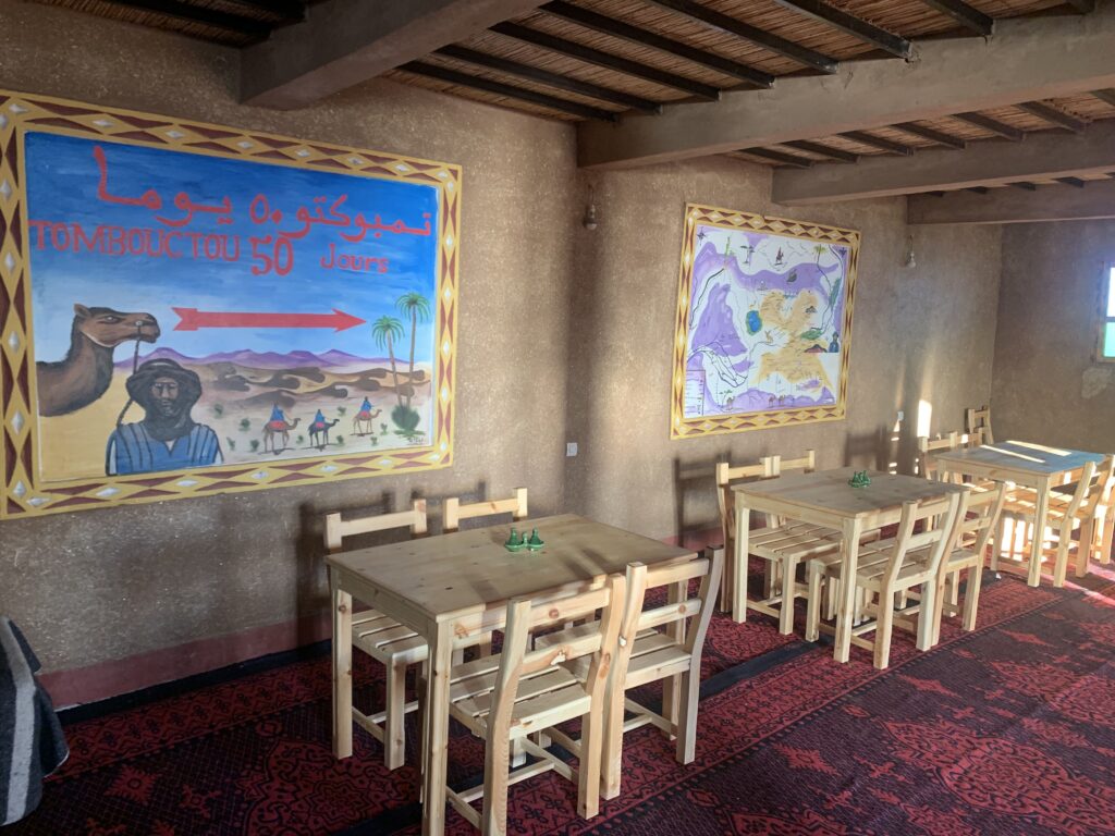 Moroccan dining room setup – enjoying traditional Moroccan food in a warm, rustic interior.