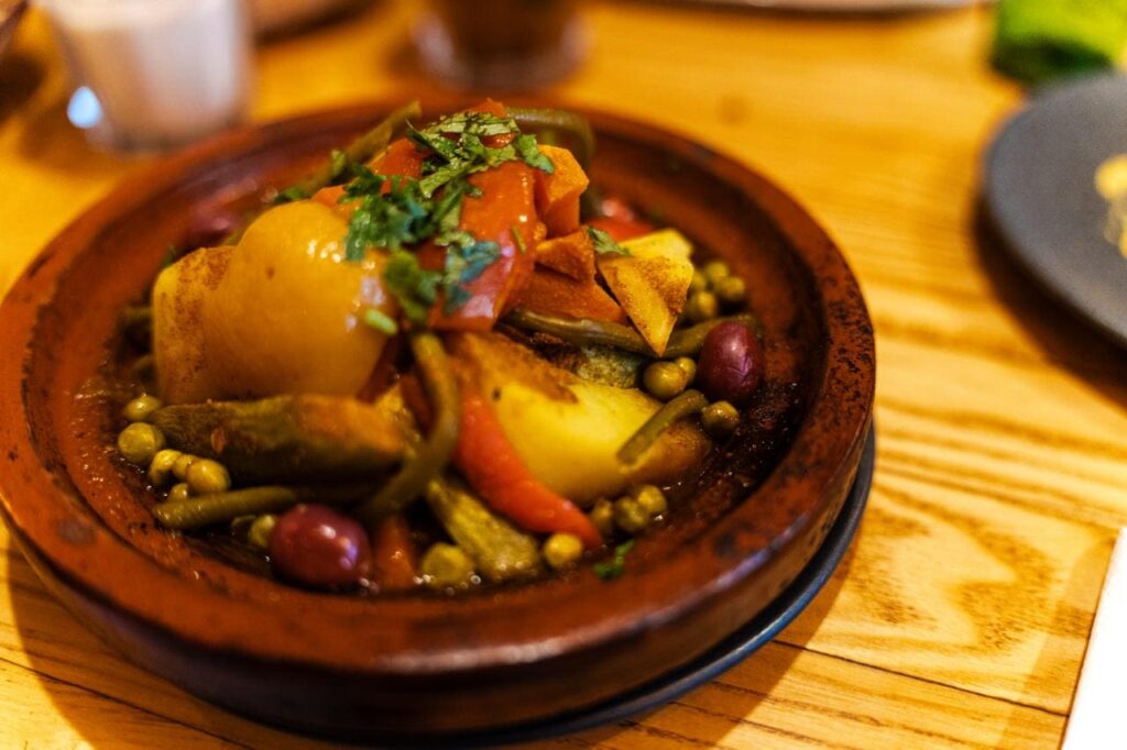 Serving traditional Moroccan food – tajine prepared and presented the authentic way.